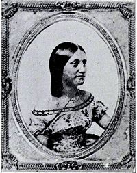 Black and white profile photograph of a 19th-century woman in Western dress