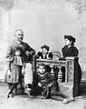 Photograph of Pontian woman, man, and children seated inside.