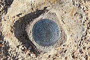 This is a brass survey marker for the Lake Wright Patman Dam installed in 1981 by the U.S. Army Corps of Engineers