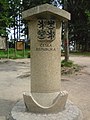 Border stone on the tripoint of the Czech Republic (foreground), Austria, and Germany