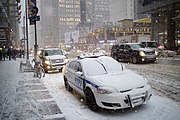 New York police and emergency management vehicles in Manhattan during Winter Storm Juno, January 2015.