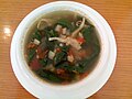 A soup containing mushroom and Corchorus olitorius leaves, served in Malolos, the Philippines, where the latter vegetable is known as saluyot.