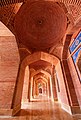 Arcades around the central courtyard feature bricks laid in geometric patterns