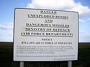 A warning sign posted "By Command of the Defence Council".