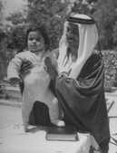 With his son Prince Hassan in 1948.