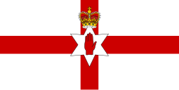 Red cross on a white field, defaced by a six-pointed star bearing a red hand ensigned by a crown.