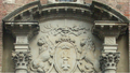 Front door and portal of Gdańsk Town Hall. The heads of the lions are turned towards the Golden Gate, according to legend, they look for help from the Polish king.[7]