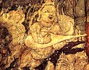 Kinnara with kachchapa veena, part of Bodhisattva Padmapani painting in Cave 1.[127]