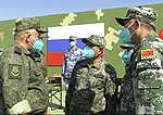 Russian and Chinese officers at Sibu/Interaction-2021 military exercises. From left to right: Russian office uniform with EMR camouflage, Type 19 office uniform with Xingkong camouflage, Type 07 camouflage uniform