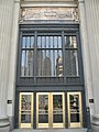London Guarantee Building entrance commemorates Fort Dearborn at the top