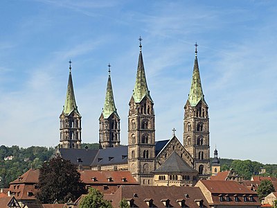 Bamberg Cathedral, Germany, has a tower at each corner, topped by spires which rise from gables and are called "rhenish helms".