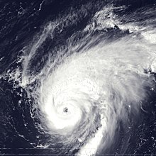 A view of Hurricane Erika from Space on September 8, 1997. The storm's eye, visible near the center of the image, is well-defined and representative of a strong hurricane. Puerto Rico and the Dominican Republic are seen to the southwest of Erika