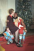 Mrs. Reagan sitting on Mr. T's lap after