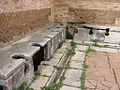 Image 38Public toilets (latrinae) from Ostia Antica (from Roman Empire)