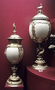 Two tall covered cups of ostrich eggs with mounts in silver-gilt