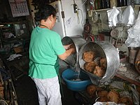 Coconut healing oil being processed by a specialist