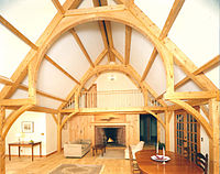 Hammerbeam used inside a modern timber frame residence