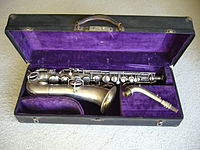 A straight-necked Conn C melody saxophone (Conn New Wonder Series 1) with a serial number that dates manufacture to 1922
