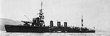 Black and white photograph of a World War II-era warship