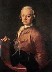 Serios-faced middle-aged man, seated facing half- left, wearing a wig and a heavy brown formal coat