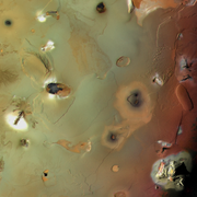 Io's Euboea Montes (below top left), Haemus Montes (lower right); north is left