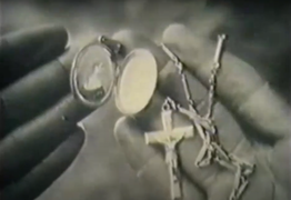 The Zulu inspect the prince's locket and crucifix