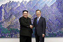 Kim Jong-un and Moon Jae-in shake hands