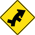 (W2-11) Staggered side road intersection, first from left on a curve to right