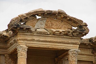 Roman mascaron with rinceaux in a segmental pediment of the Library of Celsus, Ephesus, Turkey, unknown architect, c.110 AD