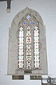 14th century window in south aisle of nave with three lights, ogee tracery and cusped rere-arch