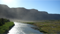 The Orange River from the border bridge between Noordoewer and Vioolsdrif. Extreme heat and sunlight cause visible evaporation.