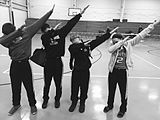 A group of teens dabbing, a popular fad and gesture of the youth around 2015–2016. Dabbing was the most prominent dance trend of the 2010s, which joined such dances as Flossing and the Harlem Shake.