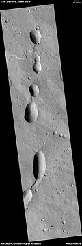 Pits with lava flow at the top of the picture Image was taken with HiRISE, under HiWish program