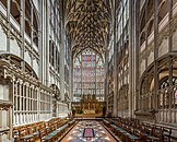 The choir of Gloucester Cathedral conveys an impression of a "cage" of stone and glass. Window tracery and wall decoration form integrated grids