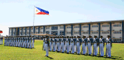 AAP midshipmen in formation in front of AJSU-IMMAJ campus.