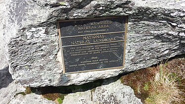 A plaque along the Long Trail between the "Chin" and the "Nose" of Mount Mansfield.