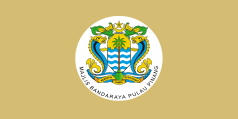 Flag of the Penang Island City Council, depicting the city's coat of arms within a white disc on top of a yellowish field.