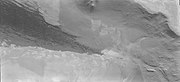 The edge of the dark dunes of Abalos Undae shown just below the polar scarp and cap