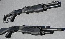 Two shotguns—the top one with a folding stock and the bottom one with a fixed stock