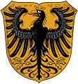 Große Kreisstadt Nördlingen In Gold ein golden gekrönter und golden bewehrter schwarzer Adler mit roter Zunge.