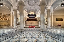 Picture of the sarcophagus of Nelson, with the tribute to Cooke on the left, in the crypt of St Paul's Cathedral
