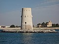 Al-Maqta' Tower (Arabic: بُرْج ٱلْمَقْطَع, romanized: Burj Al-Maqṭaʿ; front) and Al-Maqta' Fort (Arabic: حُصْن ٱلْمَقْطَع, romanized: Ḥuṣn Al-Maqṭaʿ; back), just outside the island of Abu Dhabi