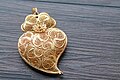 Image 16Typical Portuguese filigree heart shaped pendant, an iconic item in Portuguese fashion and design. (from Culture of Portugal)