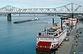 Belle of Louisville at wharf with George Rogers Clark Memorial Bridge in distance, Louisville, Kentucky, USA, Ohio River mile 604, December 1987.