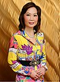 Image 168Jing Ulrich, a prominent global leader in finance, wearing brightly colored 1980s-inspired dress, 2012 (from 2010s in fashion)