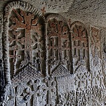 Engraved crosses on the cave church wall in the Geghard Monastery.