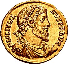 Golden coin depicting bearded man with diadem, facing right. The text around the edges reads FL CL IVLIANVS P F AVG, clockwise.