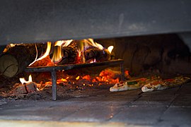 Pide baking in wood fired oven in Istanbul