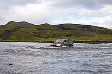 Crossing a river in Iceland Highland