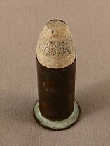 An unfired Maynard 52 caliber cartridge